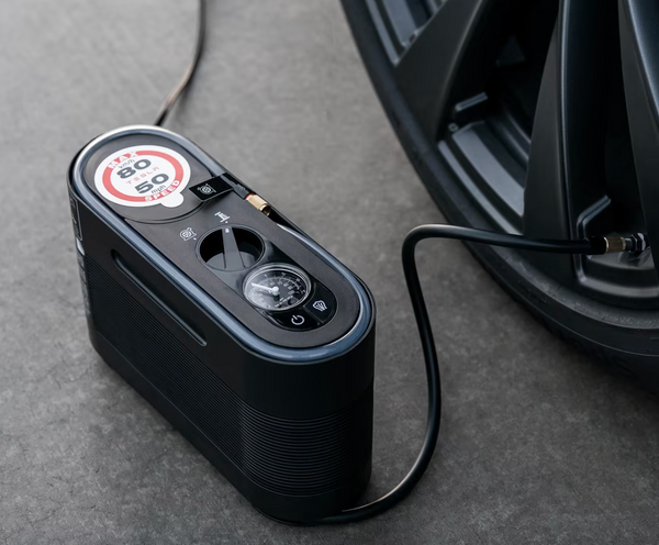 Tesla Tire Inflator Connected to Tire